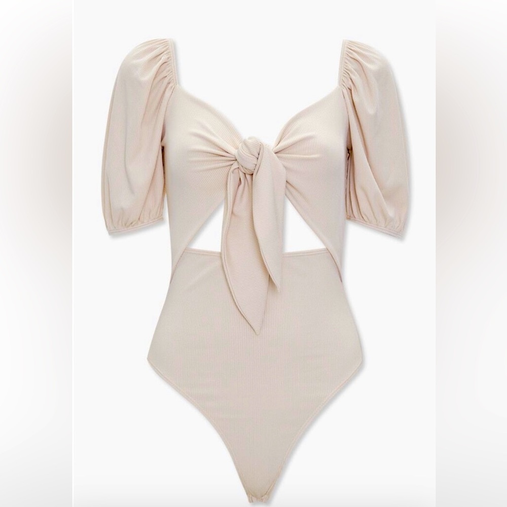 Ribbed cutout bodysuit with puff sleeve.